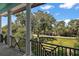 Balcony view shows a scenic view overlooking the lush greenery and peaceful surroundings at 6905 Clayton St, Mount Dora, FL 32757