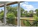 Enjoy the view from this home's balcony with decorative black metal railings at 6905 Clayton St, Mount Dora, FL 32757
