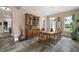 Formal dining room with beautiful slate flooring and natural light at 6905 Clayton St, Mount Dora, FL 32757
