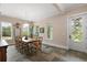 Dining room with slate flooring, natural light, and backyard view at 6905 Clayton St, Mount Dora, FL 32757