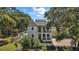 Stunning two-story home with a stucco exterior, charming balconies, and lush landscaping at 6905 Clayton St, Mount Dora, FL 32757