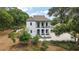 A stately two-story home with classic architectural details, balconies, and a well-manicured front yard exudes curb appeal at 6905 Clayton St, Mount Dora, FL 32757