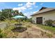 Charming garden area with a small patio set, perfect for enjoying morning coffee or an afternoon tea at 6905 Clayton St, Mount Dora, FL 32757