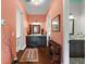 Hallway featuring lovely decor and a view of the nearby bathroom at 6905 Clayton St, Mount Dora, FL 32757