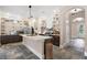 Kitchen features a central island, custom shelves, and stylish backsplash at 6905 Clayton St, Mount Dora, FL 32757