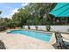 Relaxing backyard pool area with comfortable seating, creating a private oasis for leisure and recreation at 6905 Clayton St, Mount Dora, FL 32757