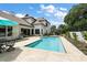 Stunning pool area with ample seating, ideal for luxurious outdoor living and enjoying the pool at 6905 Clayton St, Mount Dora, FL 32757