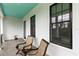 Charming front porch with rocking chairs perfect for enjoying your time outside at 6905 Clayton St, Mount Dora, FL 32757
