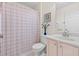 Bathroom featuring a patterned shower curtain, toilet, and vanity sink at 8097 Se 174Th Belhaven Loop, The Villages, FL 32162