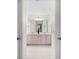En-suite bathroom with double sinks, a vanity, tile flooring, and a walk-in closet at 8097 Se 174Th Belhaven Loop, The Villages, FL 32162