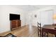 Bedroom with wood floors, a ceiling fan, and lots of natural light at 8097 Se 174Th Belhaven Loop, The Villages, FL 32162