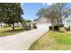 Charming single-story home with a well-maintained driveway and manicured lawn, on a sunny day at 8097 Se 174Th Belhaven Loop, The Villages, FL 32162