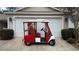 Golf cart parked in front of the garage at 8097 Se 174Th Belhaven Loop, The Villages, FL 32162