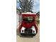 Rear view of a white golf cart with red seat covers at 8097 Se 174Th Belhaven Loop, The Villages, FL 32162