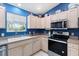 Modern kitchen with stainless steel appliances and ample cabinet space for storage at 8097 Se 174Th Belhaven Loop, The Villages, FL 32162