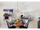 Open-concept kitchen and living area with modern appliances, an island, and a breakfast nook at 8097 Se 174Th Belhaven Loop, The Villages, FL 32162