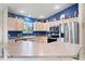 Well-lit kitchen featuring stainless steel appliances and neutral countertops at 8097 Se 174Th Belhaven Loop, The Villages, FL 32162