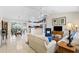 Bright, open-concept living room seamlessly flows into a modern kitchen and dining area at 8097 Se 174Th Belhaven Loop, The Villages, FL 32162