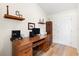 Home office with hardwood floors, vaulted ceiling, and a large wood desk at 8097 Se 174Th Belhaven Loop, The Villages, FL 32162