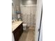 Cozy bathroom with a shower-tub combination and updated vanity at 2504 Cavender Creek Rd, Minneola, FL 34715