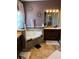 Bathroom featuring a soaking tub, vanity with mirror, and stylish decor at 2504 Cavender Creek Rd, Minneola, FL 34715