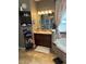 Bathroom featuring a soaking tub, vanity, and neutral-toned decor at 2504 Cavender Creek Rd, Minneola, FL 34715