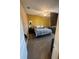 Bedroom features an accent wall, carpet, fan and simple furnishings at 2504 Cavender Creek Rd, Minneola, FL 34715
