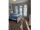 Comfortable bedroom featuring natural light and neutral colors at 2504 Cavender Creek Rd, Minneola, FL 34715