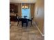 The dining area features a chandelier and tile flooring, perfect for Gathering meals at 2504 Cavender Creek Rd, Minneola, FL 34715