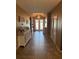 Inviting entryway with a decorative chandelier, tile flooring, and ample natural light at 2504 Cavender Creek Rd, Minneola, FL 34715