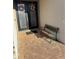Inviting home entryway with double doors, bench seating, and a beautifully paved brick patio at 2504 Cavender Creek Rd, Minneola, FL 34715