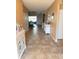 Inviting entryway with tiled floors, neutral paint, and a view into the living area at 2504 Cavender Creek Rd, Minneola, FL 34715