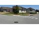 Single-story house with a three-car garage at a street corner, with a well-manicured lawn at 2504 Cavender Creek Rd, Minneola, FL 34715