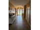 Inviting foyer featuring decorative lighting, tile flooring, and stylish accents at 2504 Cavender Creek Rd, Minneola, FL 34715