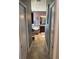 Hallway view leading to a bathroom showcasing a soaking tub and dual sink vanity at 2504 Cavender Creek Rd, Minneola, FL 34715
