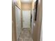 Hallway with closet and neutral walls at 2504 Cavender Creek Rd, Minneola, FL 34715
