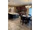 Bright kitchen with a large center island, stainless steel appliances, and dark wood cabinetry at 2504 Cavender Creek Rd, Minneola, FL 34715