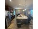Spacious kitchen with granite island, stainless steel appliances, and tile floors at 2504 Cavender Creek Rd, Minneola, FL 34715