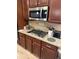Well-equipped kitchen with stainless steel appliances, granite countertops, and ample cabinet space at 2504 Cavender Creek Rd, Minneola, FL 34715
