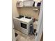 Functional laundry room with modern washer and dryer units and ample storage space at 2504 Cavender Creek Rd, Minneola, FL 34715
