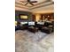 An open living room features dark leather seating, neutral walls, and tile floors at 2504 Cavender Creek Rd, Minneola, FL 34715