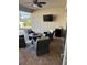 Covered patio with comfortable seating, a table, and a view of the pool at 2504 Cavender Creek Rd, Minneola, FL 34715