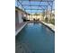 Screened-in pool featuring a brick paver deck, with table and chairs for outdoor dining at 2504 Cavender Creek Rd, Minneola, FL 34715