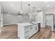 A kitchen island features a sink and dishwasher at 10033 Canterbury Dr, Leesburg, FL 34788