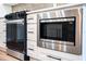 A kitchen with modern appliances, including a microwave and oven at 10033 Canterbury Dr, Leesburg, FL 34788