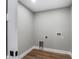 The laundry room has wood-look floors and utility hook ups at 10033 Canterbury Dr, Leesburg, FL 34788