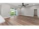 A view of the living room with a sliding glass door at 10033 Canterbury Dr, Leesburg, FL 34788