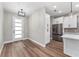 Front door view of the living room, kitchen, and dining area at 10033 Canterbury Dr, Leesburg, FL 34788