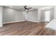 Large living room with a ceiling fan at 10033 Canterbury Dr, Leesburg, FL 34788
