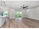 Open concept living space with sliding glass doors leading to the backyard at 10033 Canterbury Dr, Leesburg, FL 34788